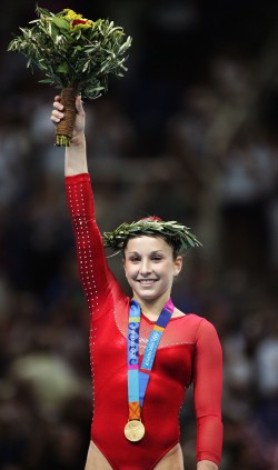 Carly Patterson on the 2004 Athens Olympic podium with gold medal